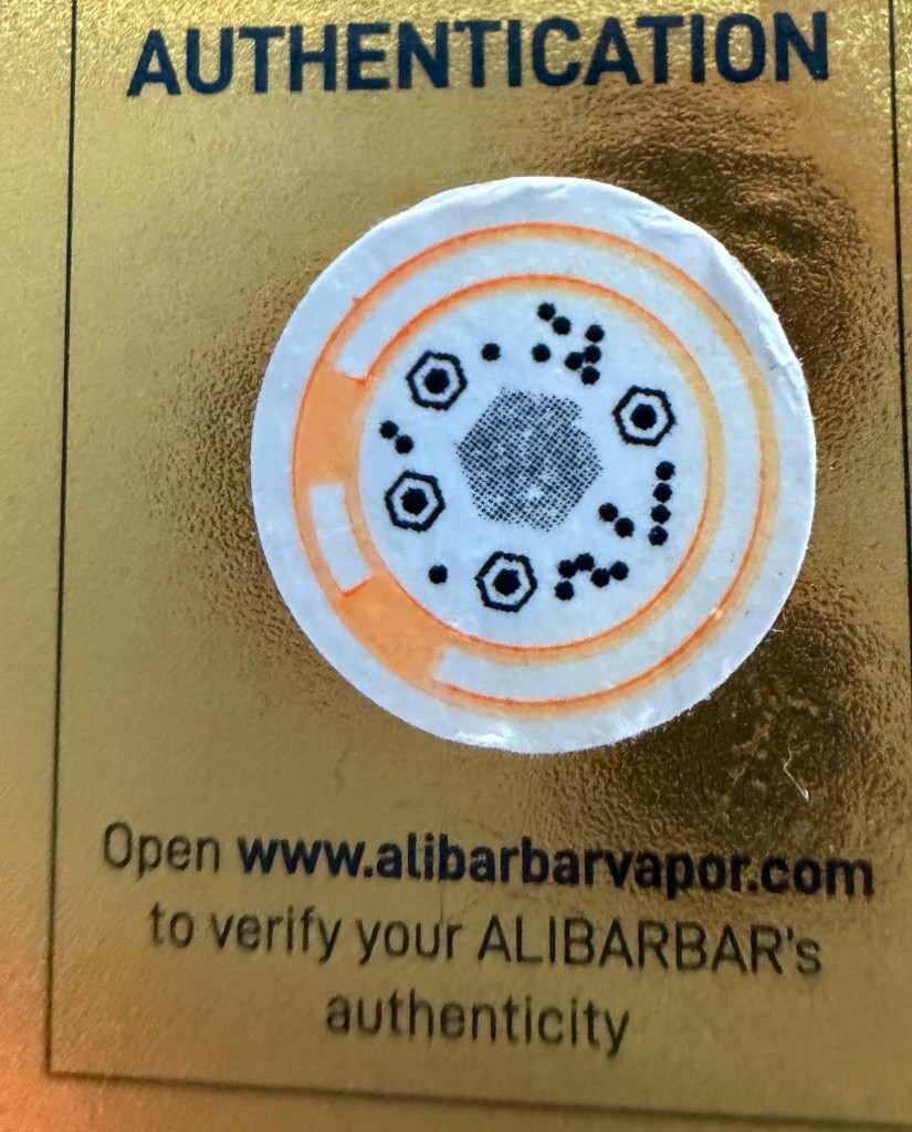 The authentication label on Alibarbar Ingot 9000 packaging, photographed up close.